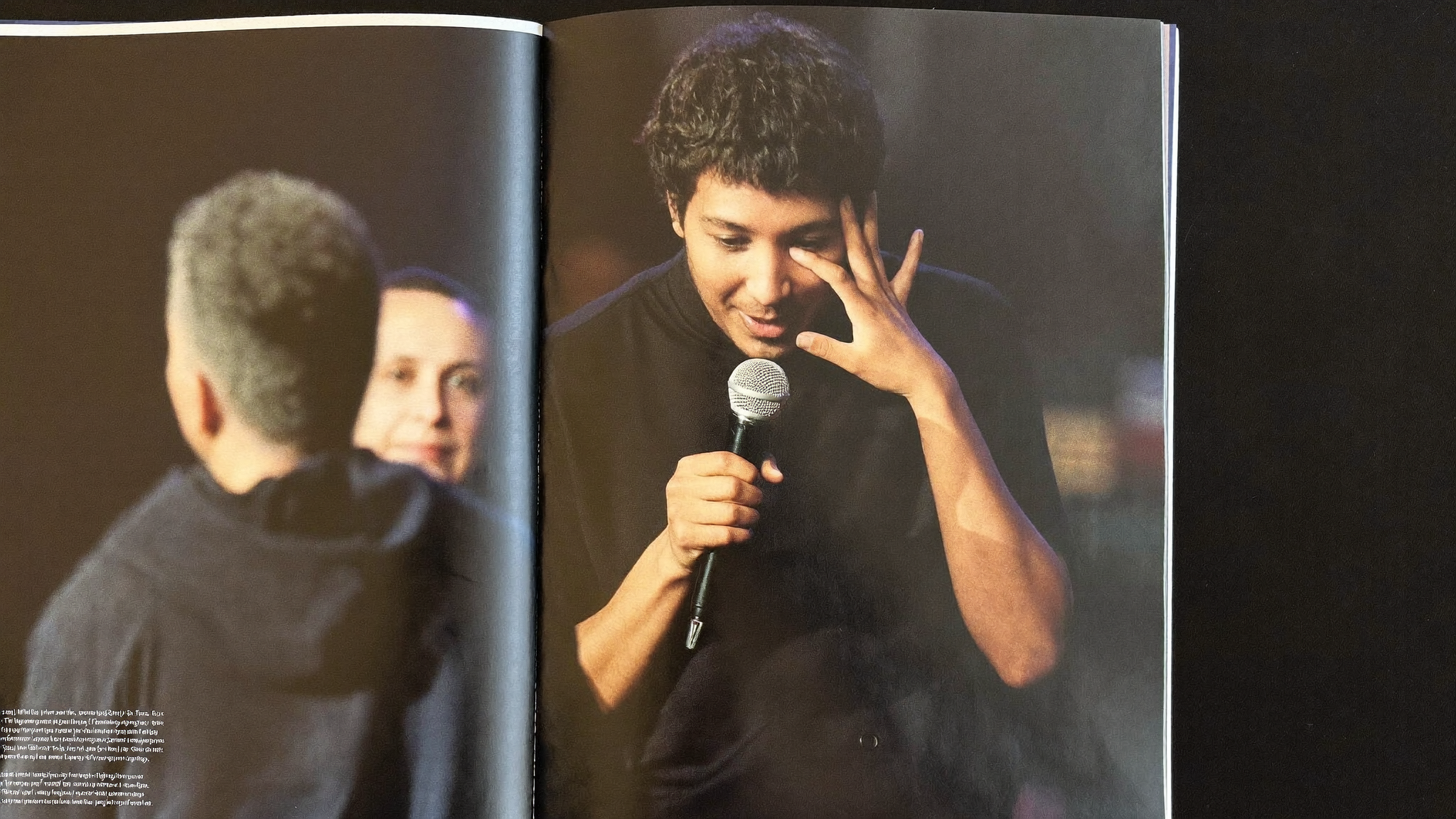 Speaker on stage making eye contact with a person in the front row